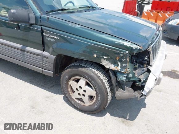 1995 Jeep Grand Cherokee Laredo with VIN 1J4FX58S0SC716398, listed as a IAAI auction lot 42647346 with 58,184 mi miles and . Bid and sale history available at DreamBid. Image 13.