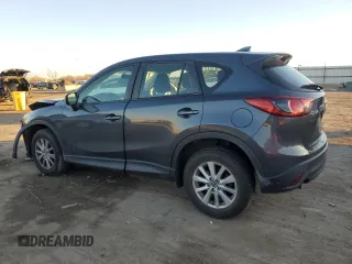 2016 Mazda CX-5 Sport with VIN JM3KE2BY9G0771969, listed as a Copart auction lot 80966064 with 99,348 mi miles and Salvage title. Bid and sale history available at DreamBid. Image 2.