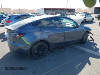 2023 Tesla Model Y Long Range z VIN 7SAYGAEE4PF945847, wystawiony jako IAAI lot #41071924 z przebiegiem 33 454 mil mil oraz . Historia ofert i sprzedaży dostępna na DreamBid. Obrazek 4.