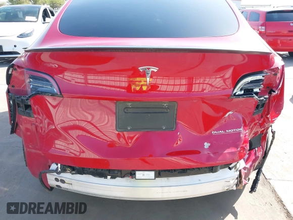 2022 Tesla Model Y Performance z VIN 7SAYGDEF0NF518740, wystawiony jako IAAI lot #41785358 z przebiegiem 50 692 mil mil oraz . Historia ofert i sprzedaży dostępna na DreamBid. Obrazek 6.