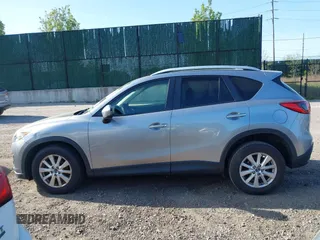 2014 Mazda CX-5 Touring with VIN JM3KE4CY0E0302583, listed as a IAAI auction lot 41947735 with 122,077 mi miles. Bid and sale history available at carsss.com. Image 14.
