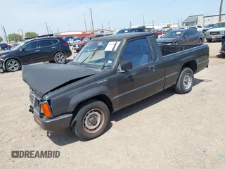 1992 Mitsubishi Mighty Max z VIN JA7FL24W9NP021503, wystawiony jako IAAI lot #41942559 z przebiegiem 162 088 mil mil oraz . Historia ofert i sprzedaży dostępna na DreamBid. Obrazek 2.