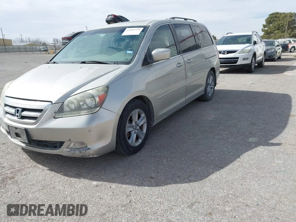 2005 Honda Odyssey TOURING with VIN 5FNRL38895B060605, listed as a IAAI auction lot 41809330 with 228,487 mi miles. Bid and sale history available at carsss.com. Image 2.