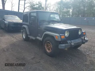 2005 Jeep Wrangler Sport with VIN 1J4FA49S25P302627, listed as a IAAI auction lot 42100601 with 169,650 mi miles. Bid and sale history available at carsss.com. Image 1.