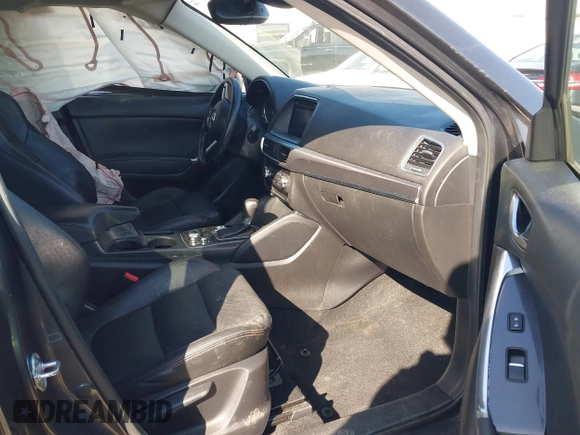 2016 Mazda CX-5 Grand Touring with VIN JM3KE4DY8G0823567, listed as a IAAI auction lot 41784384 with 143,836 mi miles and . Bid and sale history available at carsss.com. Image 5.