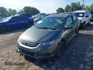 2010 Honda Insight LX with VIN JHMZE2H52AS032697, listed as a IAAI auction lot 42255794 with 262,251 mi miles and . Bid and sale history available at DreamBid. Image 2.