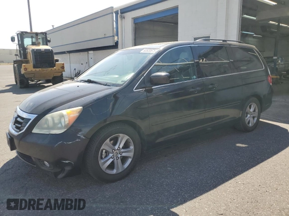 2010 Honda Odyssey Touring with VIN 5FNRL3H9XAB067890, listed as a Copart auction lot 63520575 with 213,582 mi miles and Clean title. Bid and sale history available at DreamBid. Image 1.