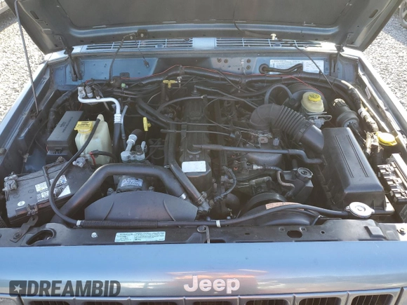 1999 Jeep Cherokee Sport with VIN 1J4FT68S1XL577603, listed as a Copart auction lot 54216115 with 180,128 mi miles and Salvage title. Bid and sale history available at DreamBid. Image 12.
