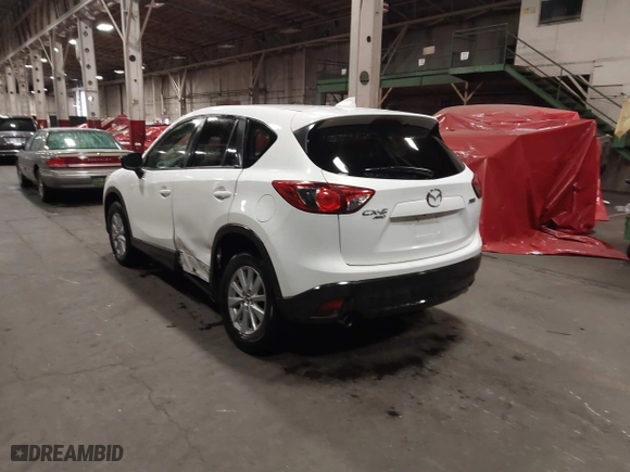 2016 Mazda CX-5 Touring with VIN JM3KE4CY0G0853261, listed as a IAAI auction lot 41861176 with 63,491 mi miles. Bid and sale history available at carsss.com. Image 3.