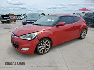 2013 Hyundai Veloster w/Gray Int z VIN KMHTC6AD7DU142655, wystawiony jako Copart lot #56233005 z przebiegiem 181 297 mil mil oraz Czysty tytuł • Clean title. Historia ofert i sprzedaży dostępna na DreamBid. Obrazek 1.