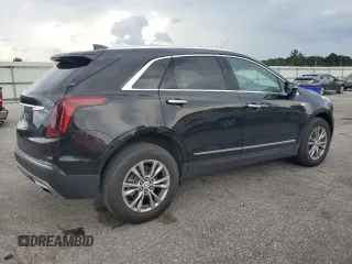 2023 Cadillac XT5 AWD Premium Luxury with VIN 1GYKNDRSXPZ145763, listed as a Copart auction lot 58387365 with 51,368 mi miles and Salvage title. Bid and sale history available at DreamBid. Image 3.
