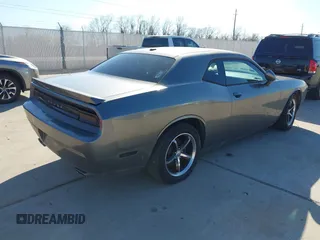 2012 Dodge Challenger SXT Plus with VIN 2C3CDYAG1CH262352, listed as a IAAI auction lot 41662002 with 141,868 mi miles. Bid and sale history available at carsss.com. Image 4.