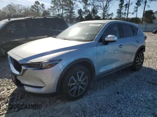 2018 Mazda CX-5 Grand Touring with VIN JM3KFBDM1J0335499, listed as a Copart auction lot 48198505 with 130,580 mi miles and Salvage Title. Bid and sale history available at carsss.com. Image 1.