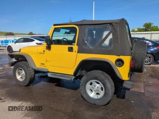 2004 Jeep Wrangler Sport z VIN 1J4FA49S64P751615, wystawiony jako Copart lot #55810895 z przebiegiem 128 165 mil mil oraz Szkoda całkowita • Salvage title. Historia ofert i sprzedaży dostępna na DreamBid. Obrazek 2.