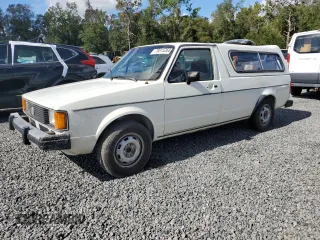 1983 Volkswagen Rabbit z VIN 1V1KG0170DV038002, wystawiony jako Copart lot #79815264 z przebiegiem 147 480 mil mil oraz Szkody całkowita. Historia ofert i sprzedaży dostępna na DreamBid. Obrazek 1.