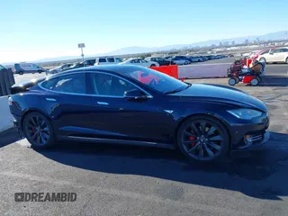 2014 Tesla Model S 60 with VIN 5YJSA1H14EFP57209, listed as a IAAI auction lot 41305157 with 141,364 mi miles and . Bid and sale history available at DreamBid. Image 14.
