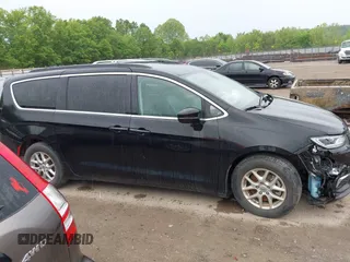 2022 Chrysler Pacifica Touring L with VIN 2C4RC1BG3NR106311, listed as a IAAI auction lot 42158651 with 68,473 mi miles and . Bid and sale history available at DreamBid. Image 14.