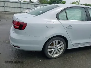 2017 Volkswagen Jetta SEL z VIN 3VWL17AJ6HM412147, wystawiony jako Copart lot #63333085 z przebiegiem Nie podano mil oraz Szkoda całkowita • Salvage title. Historia ofert i sprzedaży dostępna na DreamBid. Obrazek 14.