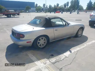1991 Mazda MX-5 Miata Special Edition z VIN JM1NA3511M1235948, wystawiony jako IAAI lot #42322754 z przebiegiem 151 065 mil mil oraz . Historia ofert i sprzedaży dostępna na DreamBid. Obrazek 4.