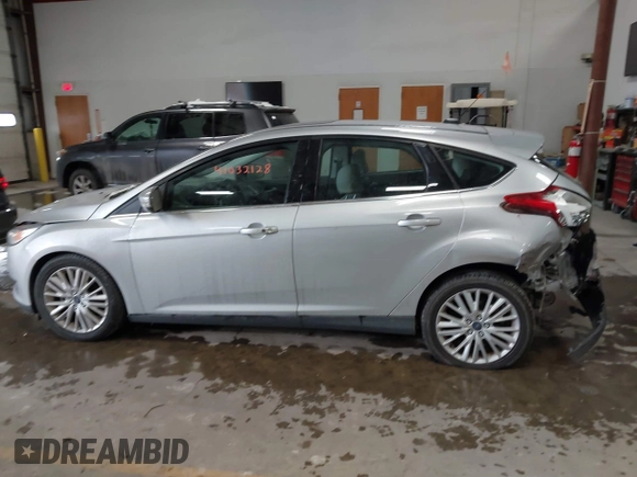 2018 Ford Focus Titanium with VIN 1FADP3N25JL261736, listed as a IAAI auction lot 41032128 with 59,142 mi miles and . Bid and sale history available at DreamBid. Image 14.