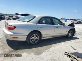 2000 Mazda Millenia with VIN JM1TA2210Y1614967, listed as a Copart auction lot 53606185 with 120,288 mi miles and Salvage Title. Bid and sale history available at DreamBid. Image 3.