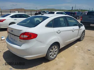 2012 Ford Fiesta SE with VIN 3FADP4BJ8CM161701, listed as a IAAI auction lot 42140579 with 59,496 mi miles. Bid and sale history available at carsss.com. Image 4.