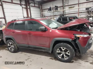 2015 Jeep Cherokee Trailhawk with VIN 1C4PJMBS7FW646577, listed as a IAAI auction lot 41404911 with 85,343 mi miles and . Bid and sale history available at DreamBid. Image 13.
