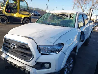 2017 Toyota Tacoma SR5 with VIN 3TMAZ5CN8HM040978, listed as a IAAI auction lot 41847492 with 103,731 mi miles and . Bid and sale history available at DreamBid. Image 6.