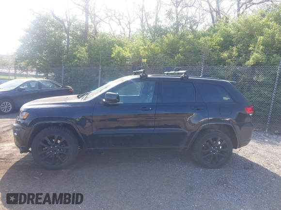 2018 Jeep Grand Cherokee Laredo E with VIN 1C4RJFAG2JC320441, listed as a IAAI auction lot 42095419 with 136,962 mi miles. Bid and sale history available at carsss.com. Image 14.