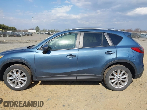 2015 Mazda CX-5 Grand Touring with VIN JM3KE4DY5F0469098, listed as a IAAI auction lot 41858792 with 174,883 mi miles. Bid and sale history available at carsss.com. Image 15.