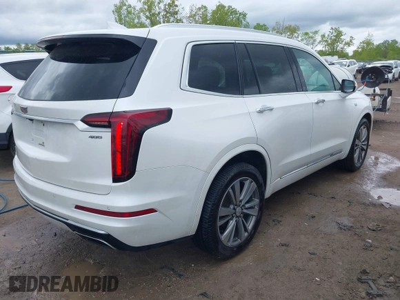 2021 Cadillac XT6 Premium Luxury z VIN 1GYKPDRS0MZ141453, wystawiony jako IAAI lot #42215954 z przebiegiem 144 245 mil mil oraz . Historia ofert i sprzedaży dostępna na DreamBid. Obrazek 4.