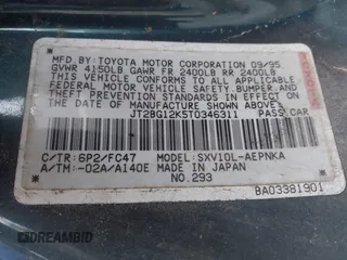 1996 Toyota Camry DX with VIN JT2BG12K5T0346311, listed as a IAAI auction lot 42130482 with 214,872 mi miles. Bid and sale history available at carsss.com. Image 9.