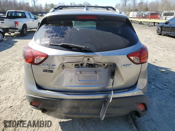 2015 Mazda CX-5 Grand Touring with VIN JM3KE4DY5F0460465, listed as a Copart auction lot 46392605 with 103,185 mi miles and Salvage Title. Bid and sale history available at carsss.com. Image 6.