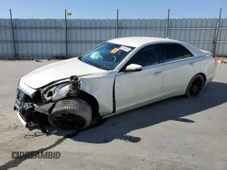2014 Cadillac CTS Luxury AWD with VIN 1G6AX5SX6E0129197, listed as a Copart auction lot 63144415 with 100,495 mi miles and Salvage title. Bid and sale history available at DreamBid. Image 1.