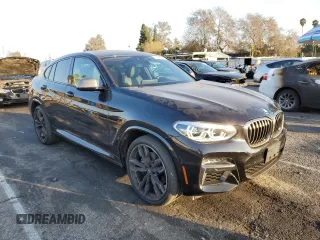 2020 BMW X4 M40i with VIN 5UX2V5C0XL9B53828, listed as a Copart auction lot 43190795 with 55,374 mi miles and Salvage title. Bid and sale history available at DreamBid. Image 4.