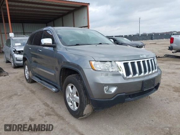 2013 Jeep Grand Cherokee Laredo with VIN 1C4RJEAG2DC571569, listed as a IAAI auction lot 41100518 with 98,265 mi miles. Bid and sale history available at carsss.com. Image 1.