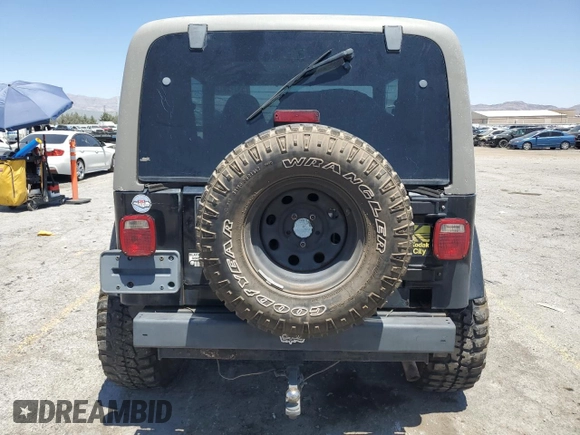 1999 Jeep Wrangler Sahara with VIN 1J4FY49S8XP472733, listed as a Copart auction lot 58174915 with 170,838 mi miles and Salvage title. Bid and sale history available at DreamBid. Image 6.