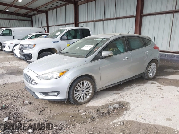 2015 Ford Focus Titanium z VIN 1FADP3N2XFL348149, wystawiony jako IAAI lot #41983021 z przebiegiem 208 765 mil mil oraz . Historia ofert i sprzedaży dostępna na DreamBid. Obrazek 17.