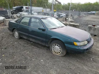 1995 Ford Taurus GL with VIN 1FALP52U8SA179395, listed as a Copart auction lot 53614265 with 71,082 mi miles and Salvage title. Bid and sale history available at DreamBid. Image 4.