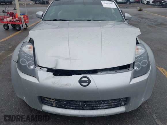 2003 Nissan 350Z Touring z VIN JN1AZ34E43T014247, wystawiony jako IAAI lot #42120812 z przebiegiem 112 263 mil mil oraz . Historia ofert i sprzedaży dostępna na DreamBid. Obrazek 6.