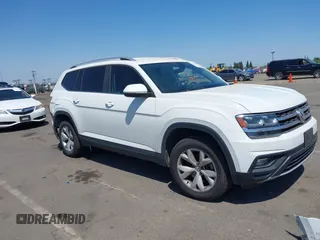 2018 Volkswagen Atlas SE z VIN 1V2LR2CA3JC520890, wystawiony jako IAAI lot #42353464 z przebiegiem 93 561 mil mil oraz . Historia ofert i sprzedaży dostępna na DreamBid. Obrazek 1.