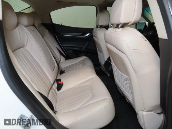 2014 Maserati Ghibli S Q4 z VIN ZAM57RTA7E1094580, wystawiony jako Copart lot #58866195 z przebiegiem 79 463 mil mil oraz Szkody całkowita. Historia ofert i sprzedaży dostępna na DreamBid. Obrazek 6.