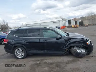 2019 Volkswagen Atlas SE z VIN 1V2UR2CA6KC580992, wystawiony jako IAAI lot #41902265 z przebiegiem 63 233 mil mil oraz . Historia ofert i sprzedaży dostępna na DreamBid. Obrazek 13.
