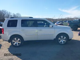 2015 Honda Pilot Touring with VIN 5FNYF3H97FB023842, listed as a IAAI auction lot 41673881 with 106,110 mi miles. Bid and sale history available at carsss.com. Image 13.
