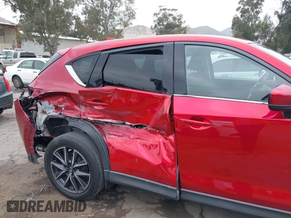2018 Mazda CX-5 Grand Touring with VIN JM3KFADMXJ0302656, listed as a IAAI auction lot 42099173 with 125,378 mi miles and . Bid and sale history available at DreamBid. Image 17.