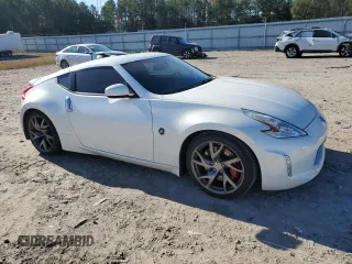 2014 Nissan 370Z Touring with VIN JN1AZ4EH1EM635411, listed as a Copart auction lot 82670344 with 77,501 mi miles and Salvage Title. Bid and sale history available at carsss.com. Image 4.