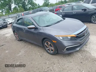 2020 Honda Civic LX z VIN 19XFC2F66LE012481, wystawiony jako IAAI lot #42297600 z przebiegiem 56 602 mil mil oraz . Historia ofert i sprzedaży dostępna na DreamBid. Obrazek 1.