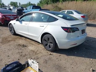 2023 Tesla Model 3 with VIN 5YJ3E1EA3PF617460, listed as a IAAI auction lot 42154401 with 9,578 mi miles and . Bid and sale history available at DreamBid. Image 3.