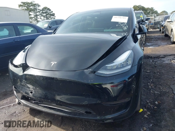 2023 Tesla Model Y Long Range z VIN 7SAYGAEE5PF603128, wystawiony jako IAAI lot #41328797 z przebiegiem 63 527 mil mil oraz . Historia ofert i sprzedaży dostępna na DreamBid. Obrazek 6.