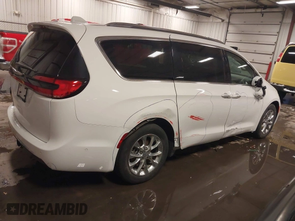 2021 Chrysler Pacifica Touring L with VIN 2C4RC1BG3MR504293, listed as a IAAI auction lot 41728608 with 70,487 mi miles and . Bid and sale history available at DreamBid. Image 18.